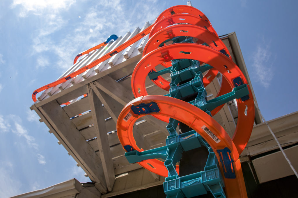 Hot Wheels car tracks snake around "This Machine Has A Soul," an art installation by Warm Cookies of the Revolution meant to get people thinking about participatory budgeting, Aug. 15, 2018. (Kevin J. Beaty/Denverite)