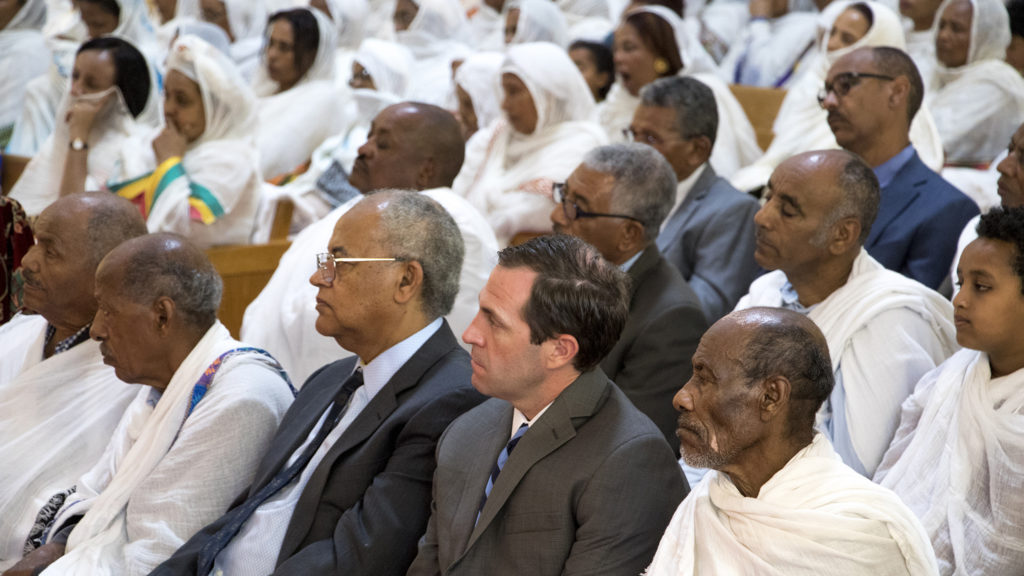 U.S. House candidate Jason Crow sits in during an Ethiopian New Year service at St. Mary Ethiopan Orthodox Church in Aurora, Sept. 9, 2018. (Kevin J. Beaty/Denverite)