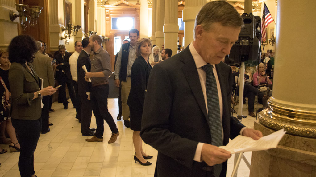Governor John Hickenlooper enters the room to announce the start of Lifelong Colorado, Sept. 18, 2018. (Kevin J. Beaty/Denverite)
