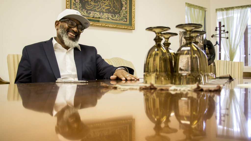 Hassan Latif, founder and executive director of Second Chance Center, speaks with a reporter in his Aurora office, Sept. 24, 2018. (Kevin J. Beaty/Denverite)