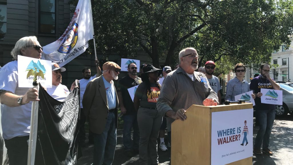 A pro-Jared Polis crowd speaks out during a rally on Walker Stapleton's state treasurer parking spot at the Capitol on Friday, Sept. 7, in Denver. (Esteban L. Hernandez)