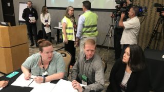 State and County election officials participate in an election preparedness exercise on Thursday, Sept. 5, at the Hilton Denver Inverness in Englewood. (Esteban L. Hernandez/Denverite)