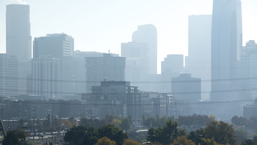 Particles hang over Denver during a winter inversion, Oct. 12, 2018. (Kevin J. Beaty/Denverite)
