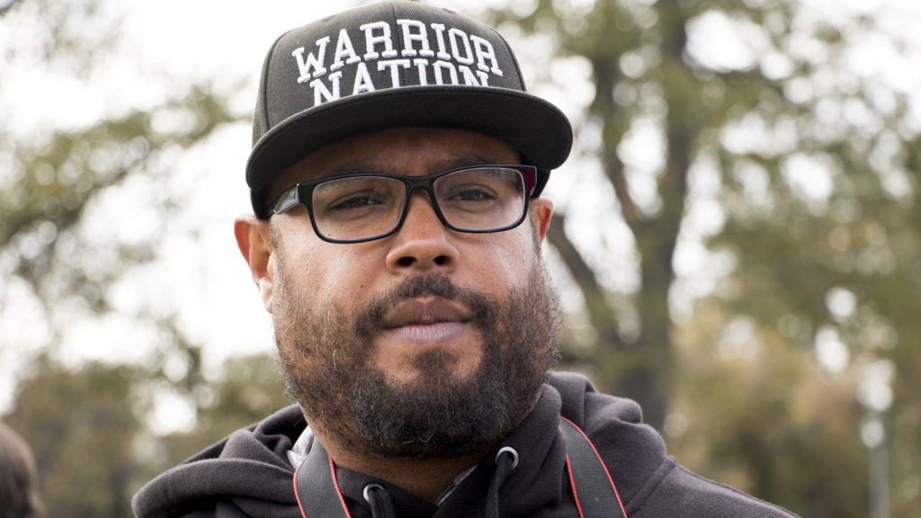 Brandon Pryor speaks to a reporter after Lisa Calderón held her first rally following as a mayoral candidate. City Park, Oct. 17, 2018.