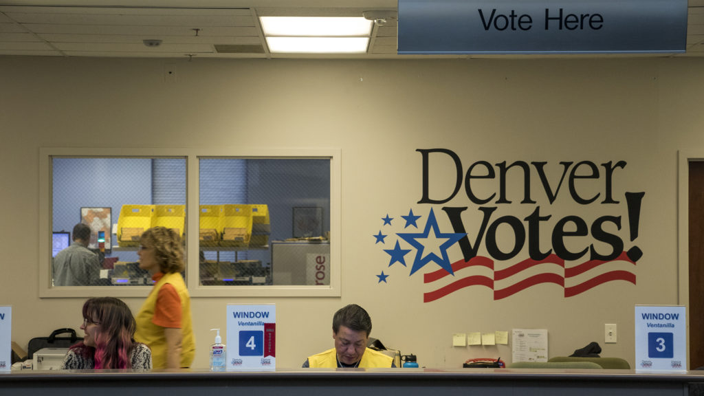 Workers at Denver Elections Division headquarters are ready for voters, Oct. 31, 2018. (Kevin J. Beaty/Denverite)