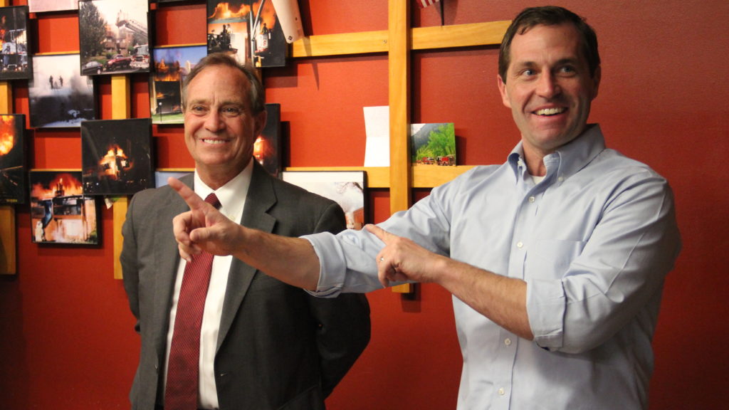 Jason Crow (right) stands next to U.S. Rep. Rep. Ed Perlmutter during a campaign stop at Aurora Fire Department Station 8 on Monday, Oct. 15, 2018. (Esteban L. Hernandez/Denverite)