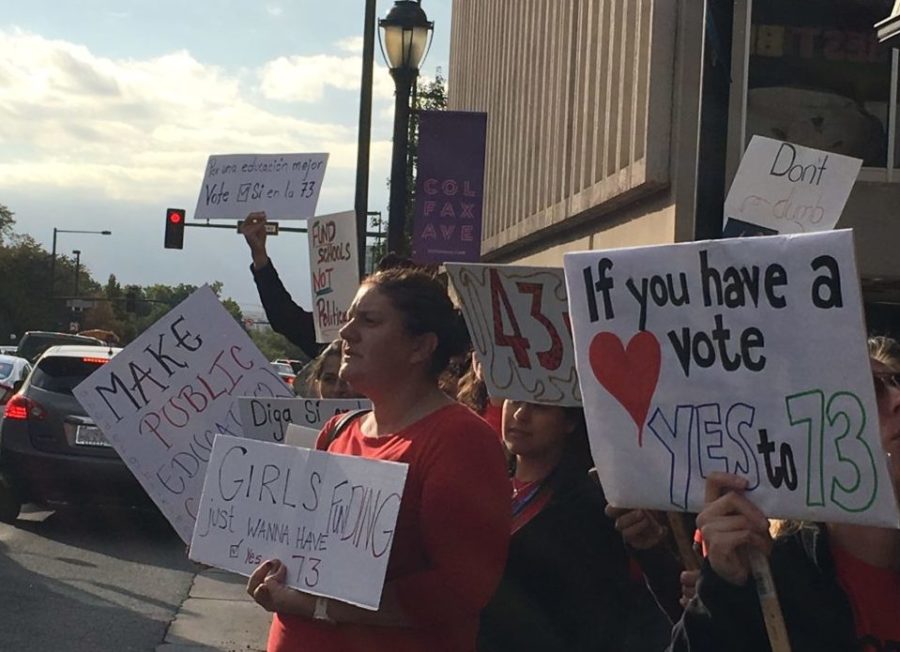 Denver teachers line Colfax Avenue to urge voters to approve Amendment 73, a tax increase to raise money for education. (Erica Meltzer/Chalkbeat)
