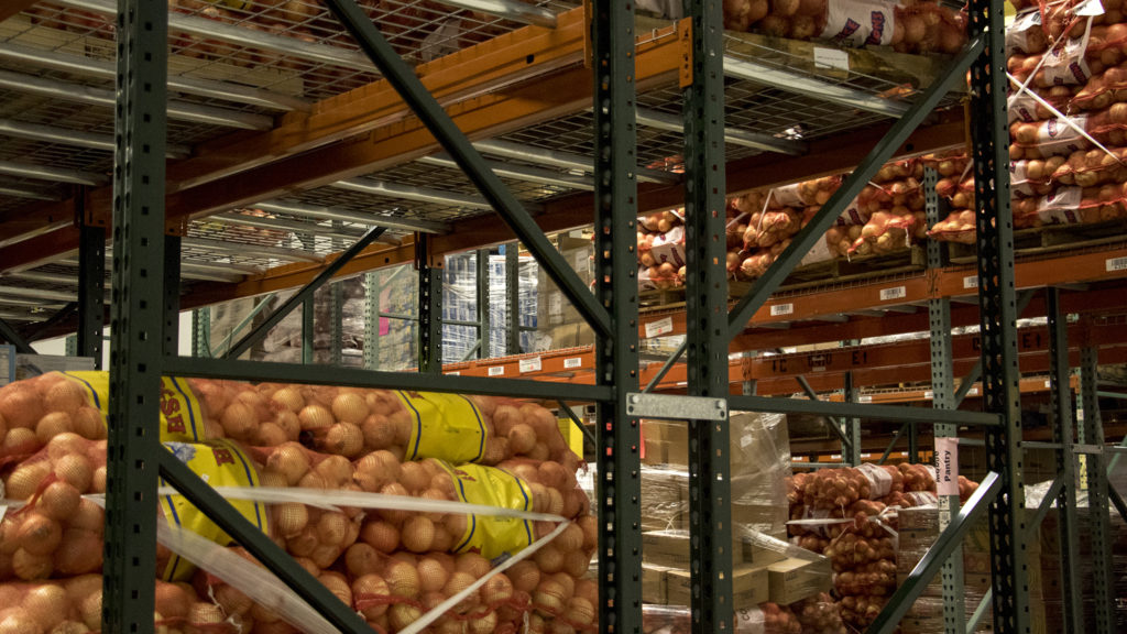 A large volume of onions in bags at Food Bank of the Rockies' warehouse in Aurora, Nov. 13, 2018. (Kevin J. Beaty/Denverite)