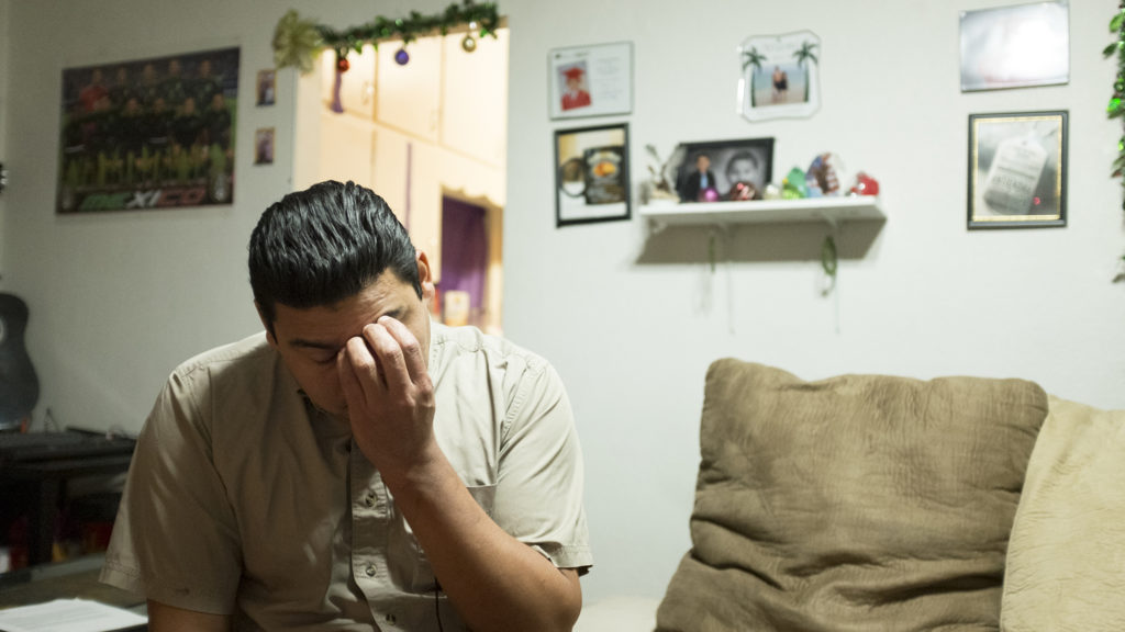 Carlos Blanco speaks with a reporter in his home in Denver's Barnum neighborhood, Dec. 7, 2018. (Kevin J. Beaty/Denverite)