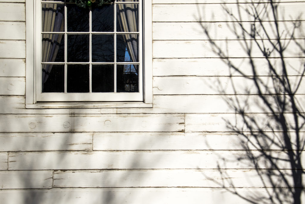 Siding in need of work on the historic Eisenhower Chapel in Lowry, Dec. 13, 2018. (Kevin J. Beaty/Denverite)