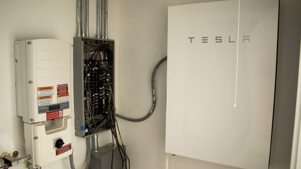 A big Tesla battery inside a solar home under construction at Habitat for Humanity's College View neighborhood site, Dec. 20, 2018. (Kevin J. Beaty/Denverite)
