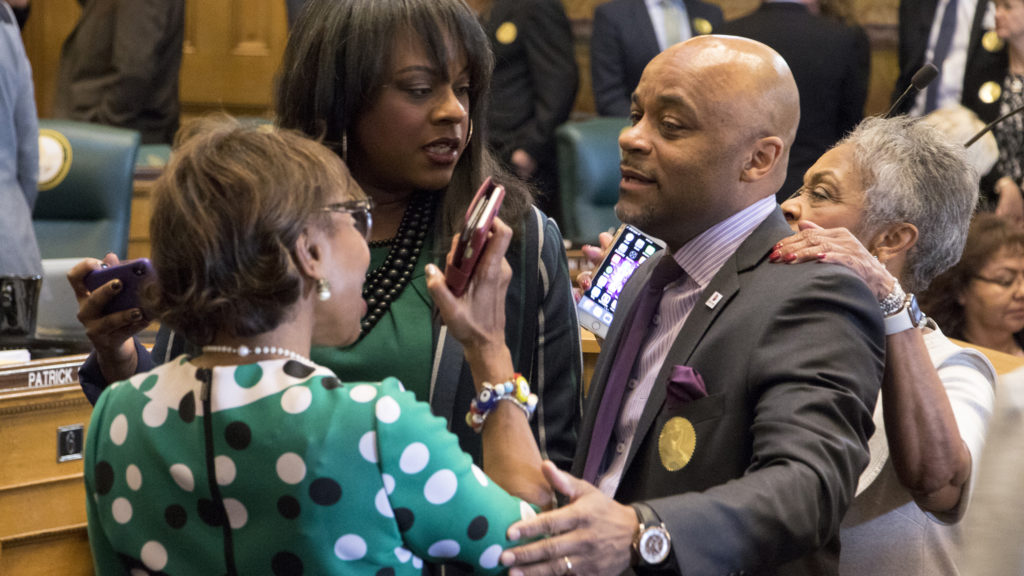 Mayor Michael Hancock greets state legislators. Governor Jared Polis gives his first State of the State address, Jan. 10, 2019. (Kevin J. Beaty/Denverite)