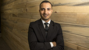 Maytham Alshadood poses for a portrait in Jason Crow's new office in Aurora, Jan. 17, 2019. (Kevin J. Beaty/Denverite)