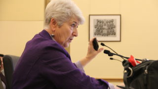 State Sen. Lois Court of Denver holds a cell phone up during a Senate Transportation & Energy committee meeting on Thursday, Jan. 24, 2019, at the Capitol. (Esteban L. Hernandez/Denverite)