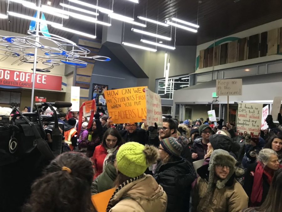 Denver teachers pack the lobby of the district headquarters to demand fair pay. (Melanie Asmar/Chalkbeat)