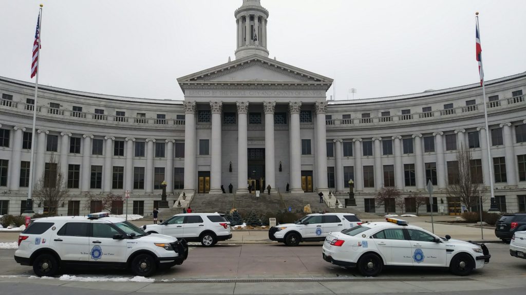 Police parked outside Denver's City and County Building during a lockdown Wed., Feb. 27, 2019. (Kevin J. Beaty/Denverite)