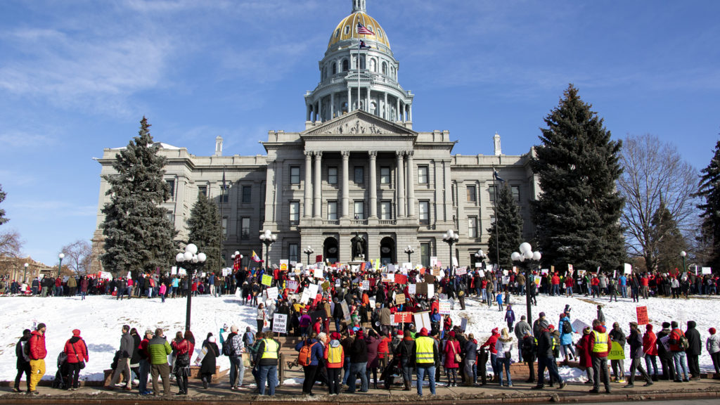 Denver teachers rally on the Captiol steps during the first day of their strike, Feb. 11, 2019. (Kevin J. Beaty/Denverite)
