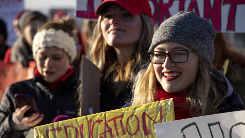 Caroline Houser, an 8th grade reading teacher at Kepner Beacon Middle School, pickets on Federal Boulevard on day one of the Denver teachers' strike, Feb. 11, 2019. (Kevin J. Beaty/Denverite)