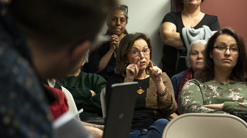 Nancy Grandys-Jones expresses concern to Nathan Hunt about the Beloved Community tiny home village during a meeting at the Globeville rec center, Feb. 15, 2019. (Kevin J. Beaty/Denverite)