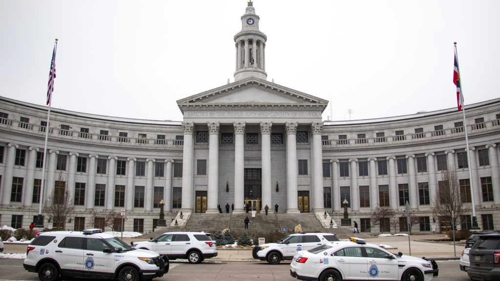Police parked outside Denver's City and County Building during a lockdown Wed., Feb. 27, 2019. (Kevin J. Beaty/Denverite)