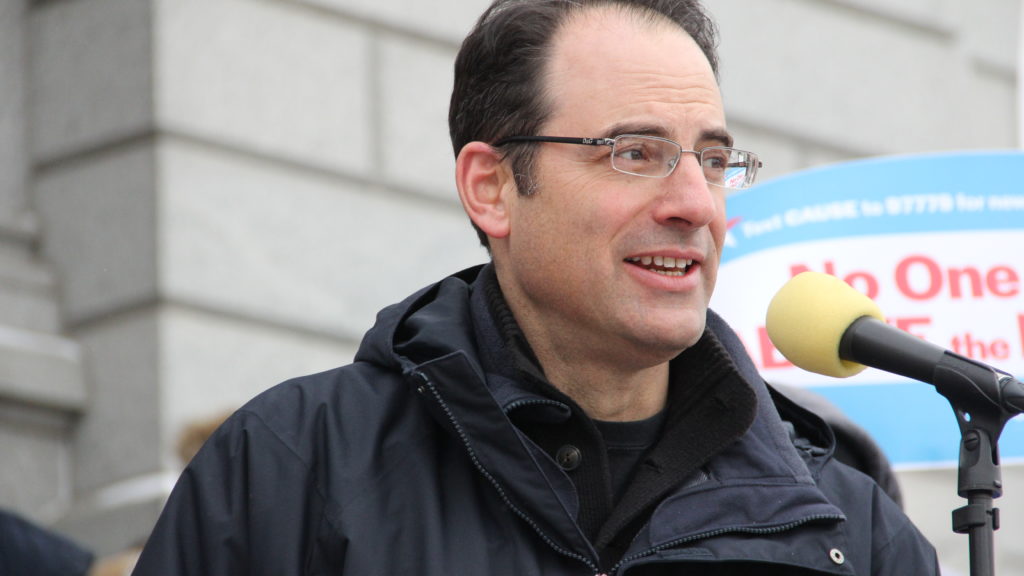 Colorado Attorney General Phil Weiser address a crowd outside the State Capitol on Monday, Feb. 18, 2019, in Denver. (Esteban L. Hernandez/Denverite)