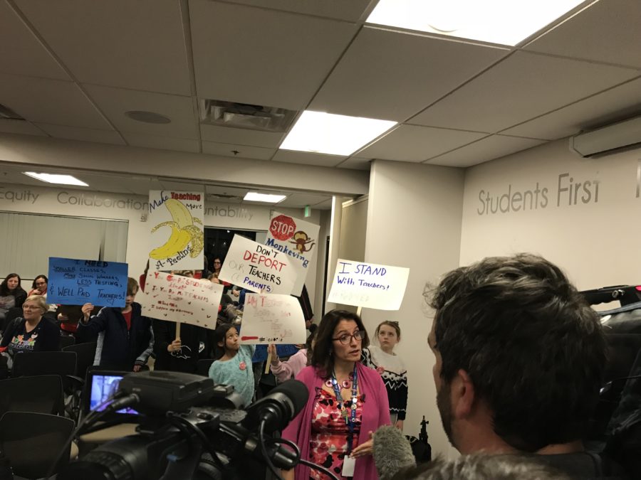 Denver Superintendent Susana Cordova speaks to news reporters after talks with the teachers union break down, as union supporters stand behind her. (Melanie Asmar/Chalkbeat)