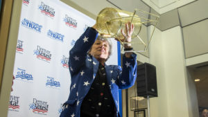 Denver Clerk and Recorder Debra Johnson shakes a bingo mixer as Denver Elections holds a lottery to determine candidate order on the upcoming municipal election ballots, March 14, 2019. (Kevin J. Beaty/Denverite)