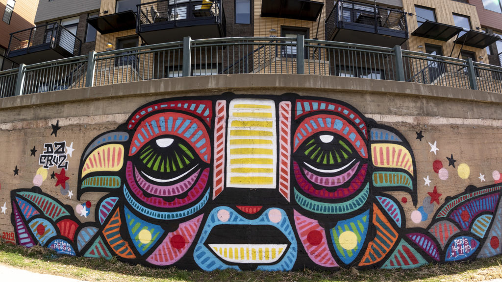A mural by French artist Da Cruz along the Cherry Creek Trail, March 26, 2019. (Kevin J. Beaty/Denverite)