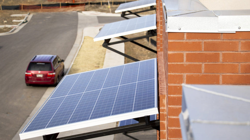 Solar panels as awnings on townhomes inside the Geos Neighborhood in Arvada, March 26, 2019.