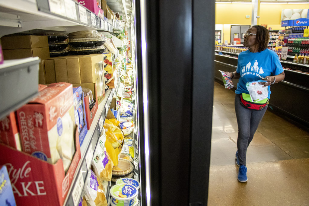 Pam Jiner shops for ingredients inside Montbello's Save A Lot for a healthy cooking class in the store's community room, March 28, 2019. (Kevin J. Beaty/Denverite)