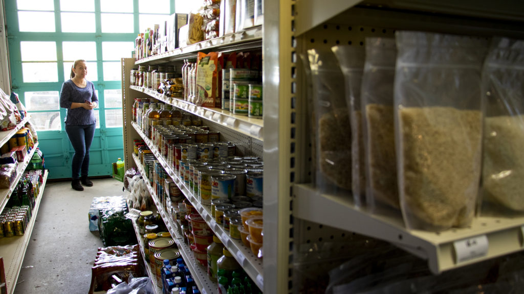 Yuri Bahena speaks to a reporter inside of the Westwood Food Cooperative's new home on Morrison Road, Westwood, April 12, 2019. (Kevin J. Beaty/Denverite)