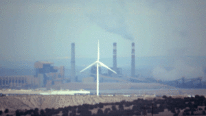 The Comanche Generating Station and a windmill near Pueblo, April 13, 2019. (Kevin J. Beaty/Denverite)