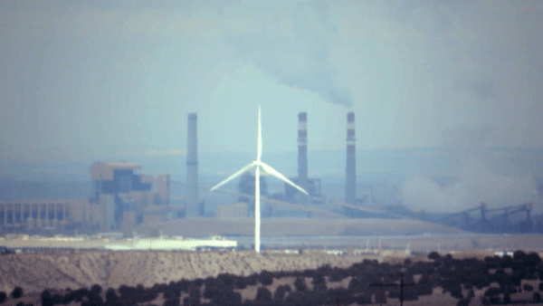 The Comanche Generating Station and a windmill near Pueblo, April 13, 2019. (Kevin J. Beaty/Denverite)