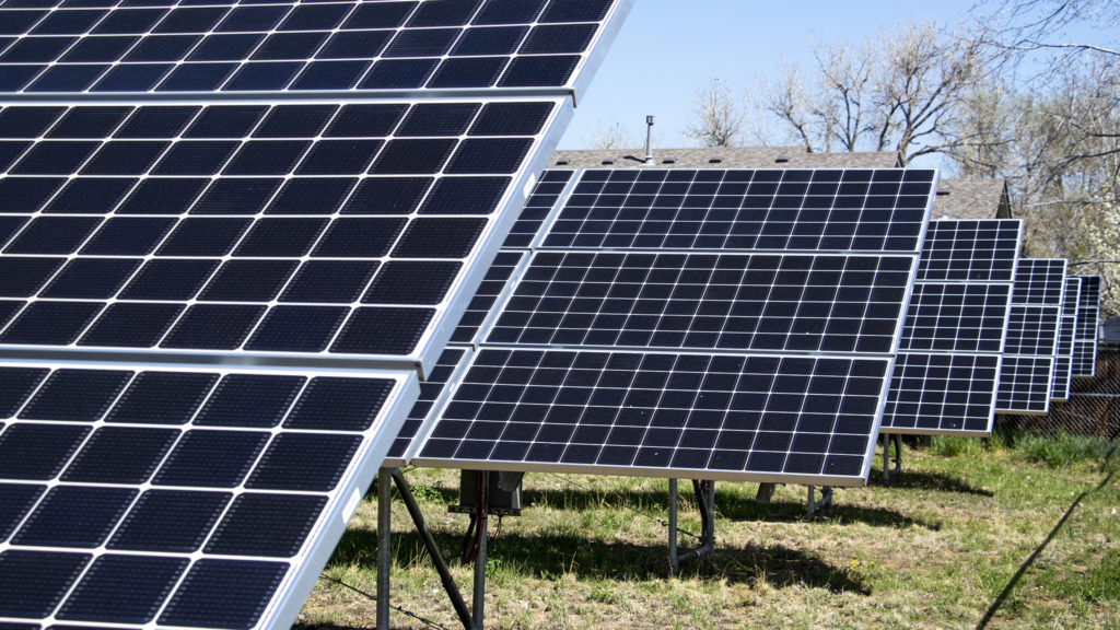A solar array behind the Fruitdale School apartments, Wheat Ridge, May 2, 2019. (Kevin J. Beaty/Denverite)