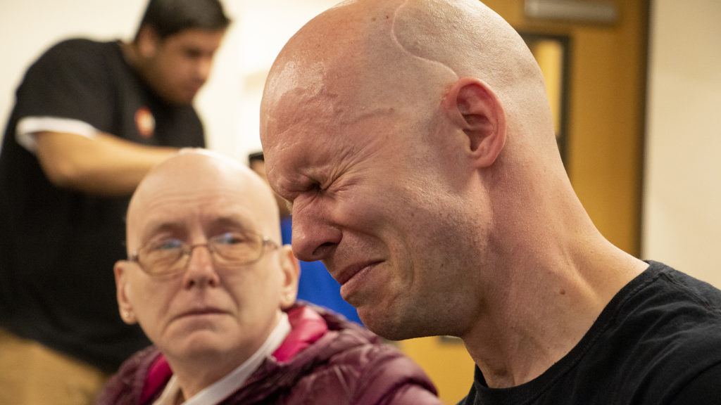 Haven Rohnart, who works with people experiencing homelessness, weeps during a watch party for Initiative 300 after initial results showed the measure was defeated, May 7, 2019. (Kevin J. Beaty/Denverite)