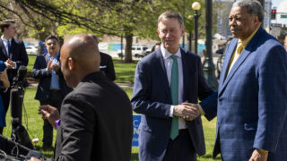 Former mayors John Hickenlooper and Wellington Webb attend a rally for Mayor Michael Hancock's reelection campaign, May 14, 2019. (Kevin J. Beaty/Denverite)