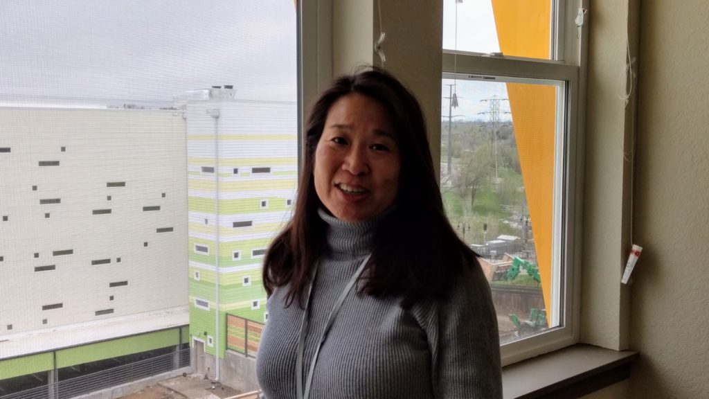 Stephanie Miller, the new CEO of The Delores Project, stands in an apartment in her nonprofit's supportive housing complex on May 1, 2019. (Donna Bryson/Denverite)