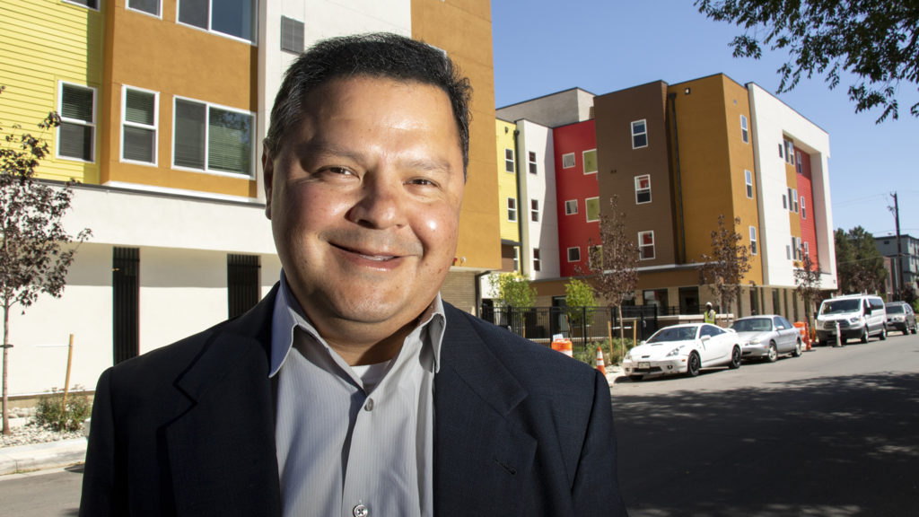 Jeff Martinez, president of Brothers Redevelopment Inc., poses for a portrait outside of his housing project in Aurora, July 10, 2019. (Kevin J. Beaty/Denverite)