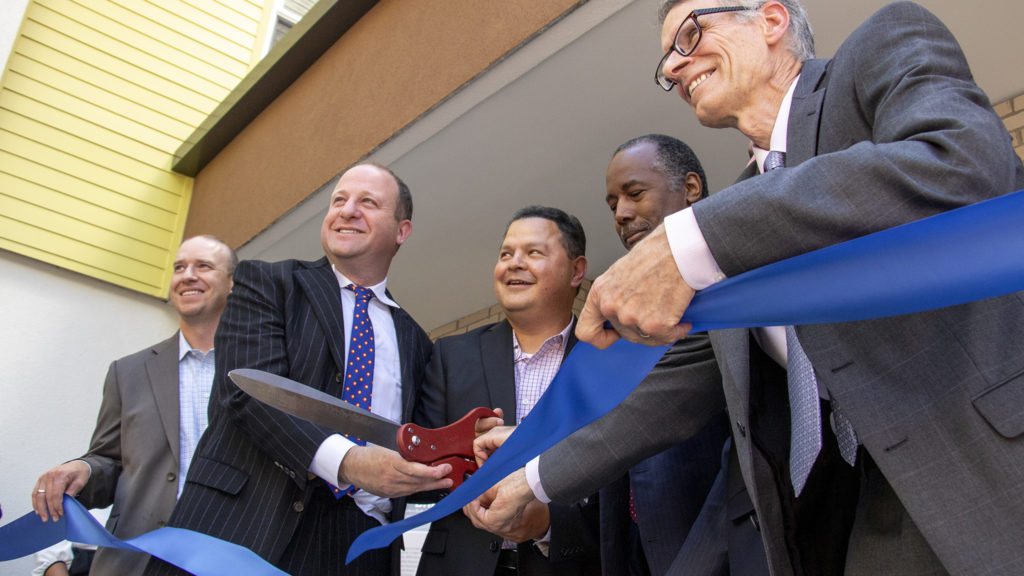 Officials cut the ribbon on a new affordable housing project in Aurora, July 12, 2019. (Kevin J. Beaty/Denverite)