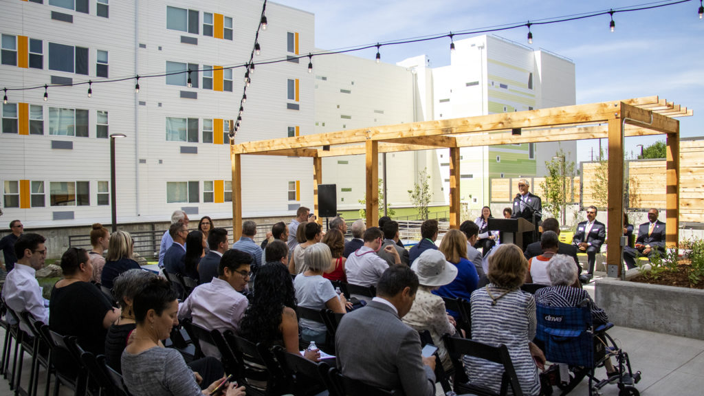 Rocky Mountain Communities interim CEO Tracy Gargaro speaks during a ribbon-cutting ceremony for the Arroyo Village apartments in Denver's West Colfax neighborhood, July 18, 2019. (Kevin J. Beaty/Denverite)