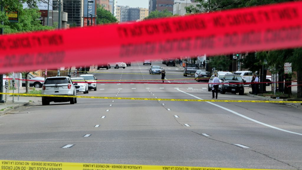 Denver police investigate an officer-involved shooting at 11th Avenue and Lincoln Street. July 1, 2019. (Kevin J. Beaty/Denverite)