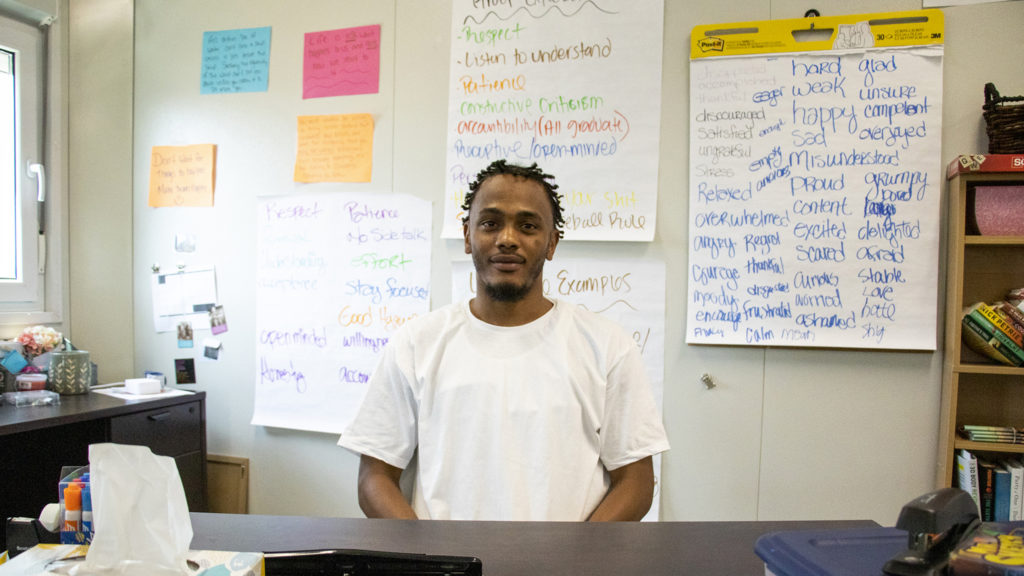 Julio Givens poses for a portrait inside a Tooley Hall classroom, Aug. 13, 2019. (Kevin J. Beaty/Denverite)