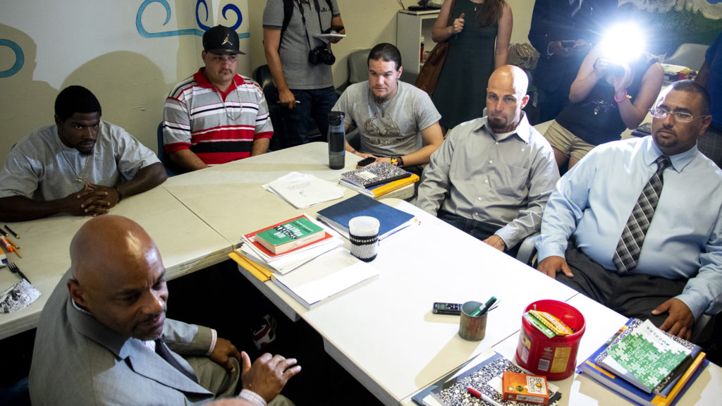 Mayor Michael Hancock meets with inmates living in CoreCivic's 90-day addiction treatment halfway house facility. Aug. 20, 2019. (Kevin J. Beaty/Denverite)