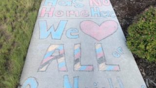 Positive messages drawn in chalk near an area where racist graffiti was found at Prairie Meadows Park in Stapleton last week. (Courtesy Melissa West)