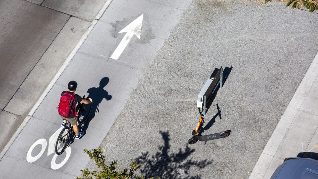A cyclist rides along Brighton Boulevard, Five Points, Sept. 24, 2019. (Kevin J. Beaty/Denverite)