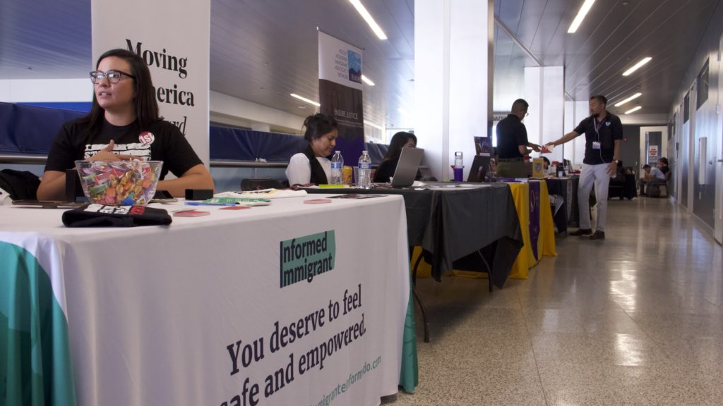 Tables set up with information on immigrant resources during a fair at Metro State University on Thursday, Sept. 26, 2019, in Denver. (Esteban L. Hernandez/Denverite)