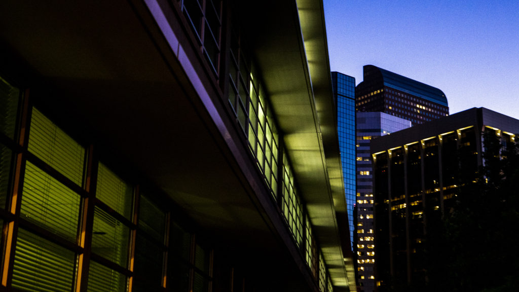 Illuminated buildings downtown at dawn, Sept. 18, 2019. (Kevin J. Beaty/Denverite)