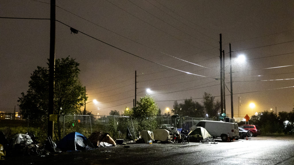 An emcampment across the street from the Salvation Army's Crossroad men's shelter a block off from Brighton Boulevard, Oct. 1, 2019. (Kevin J. Beaty/Denverite)