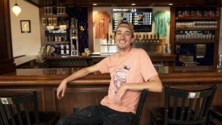Chris Bell of Call to Arms Brewing Company poses in his bar on Tennyson Street, Oct. 1, 2019. (Kevin J. Beaty/Denverite)