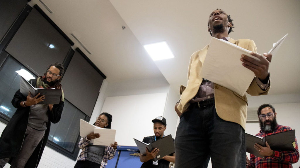 Playwright Brenton Weyi (second from right) workshops his play, "My Country, My Country," with his cast at the Robert and Judi Newman Center for Theater Education at the Denver Center for the Performing Arts, Oct. 16, 2019. (Kevin J. Beaty/Denverite)